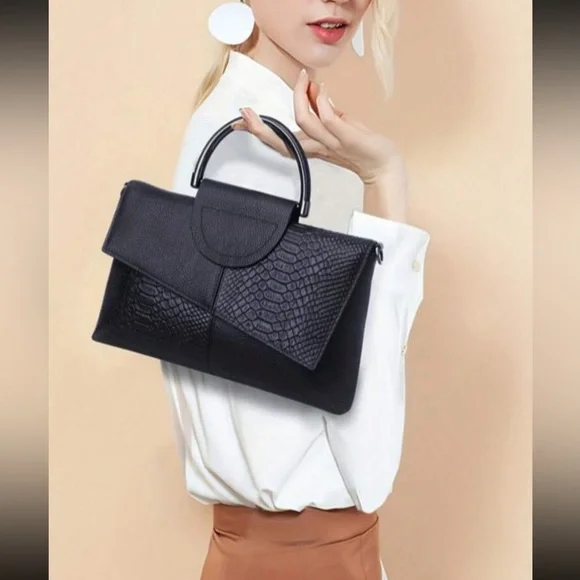 Black snakeskin print vegan leather clutchcrossbody bag